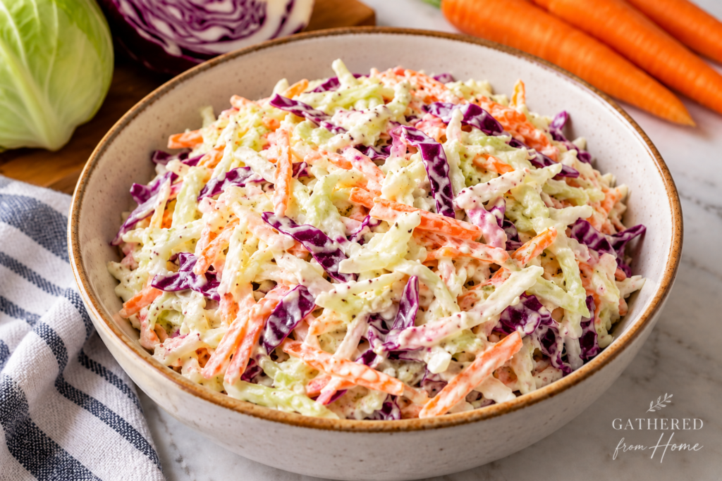 Creamy coleslaw with shredded green cabbage, red cabbage and carrots