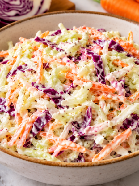 Creamy coleslaw with shredded green cabbage, red cabbage and carrots